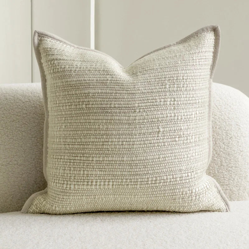 Housse de coussin ivoire texturée